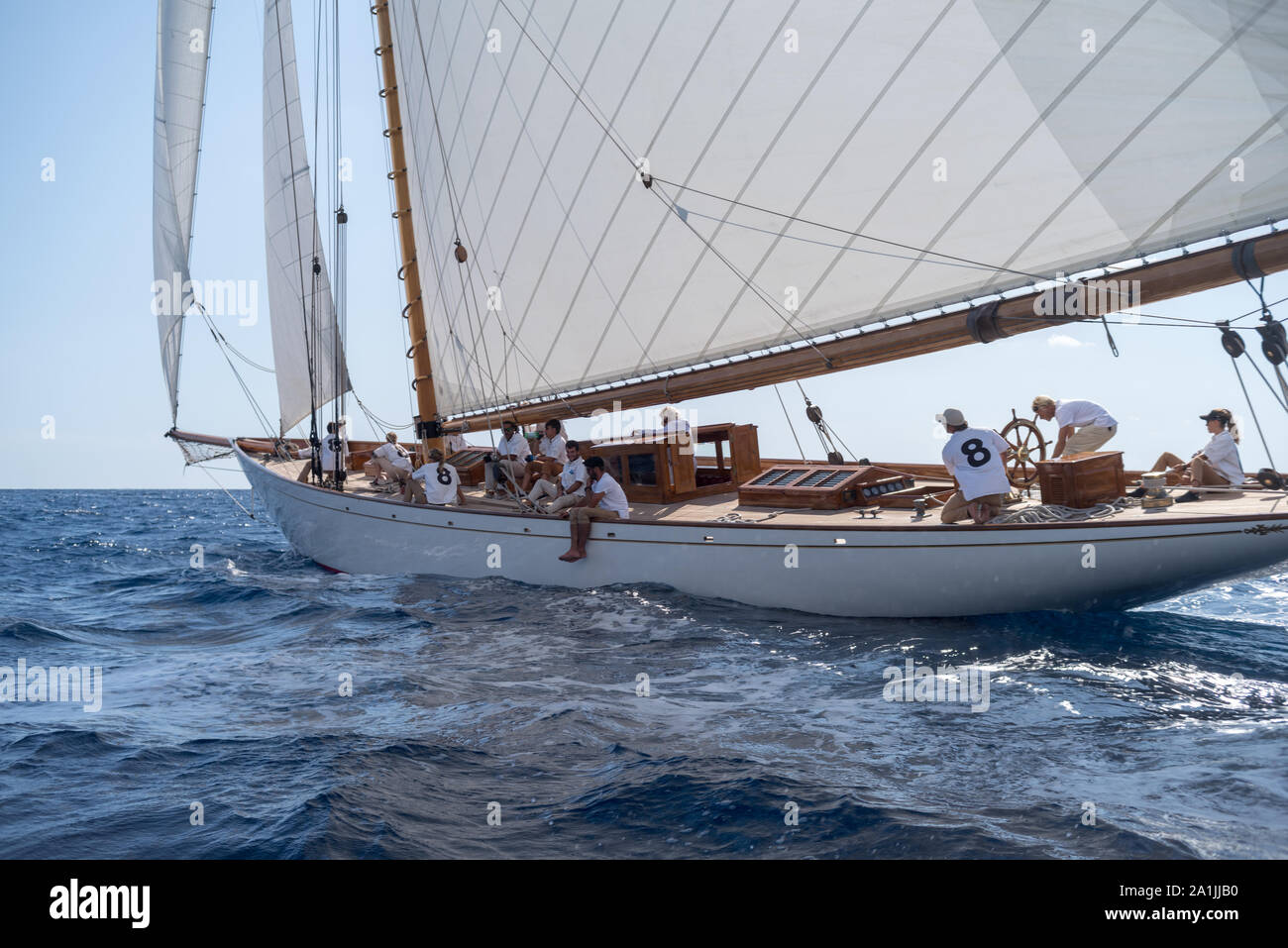 Crew members aboard on Moonbeam IV classic sail yacht, during regata in