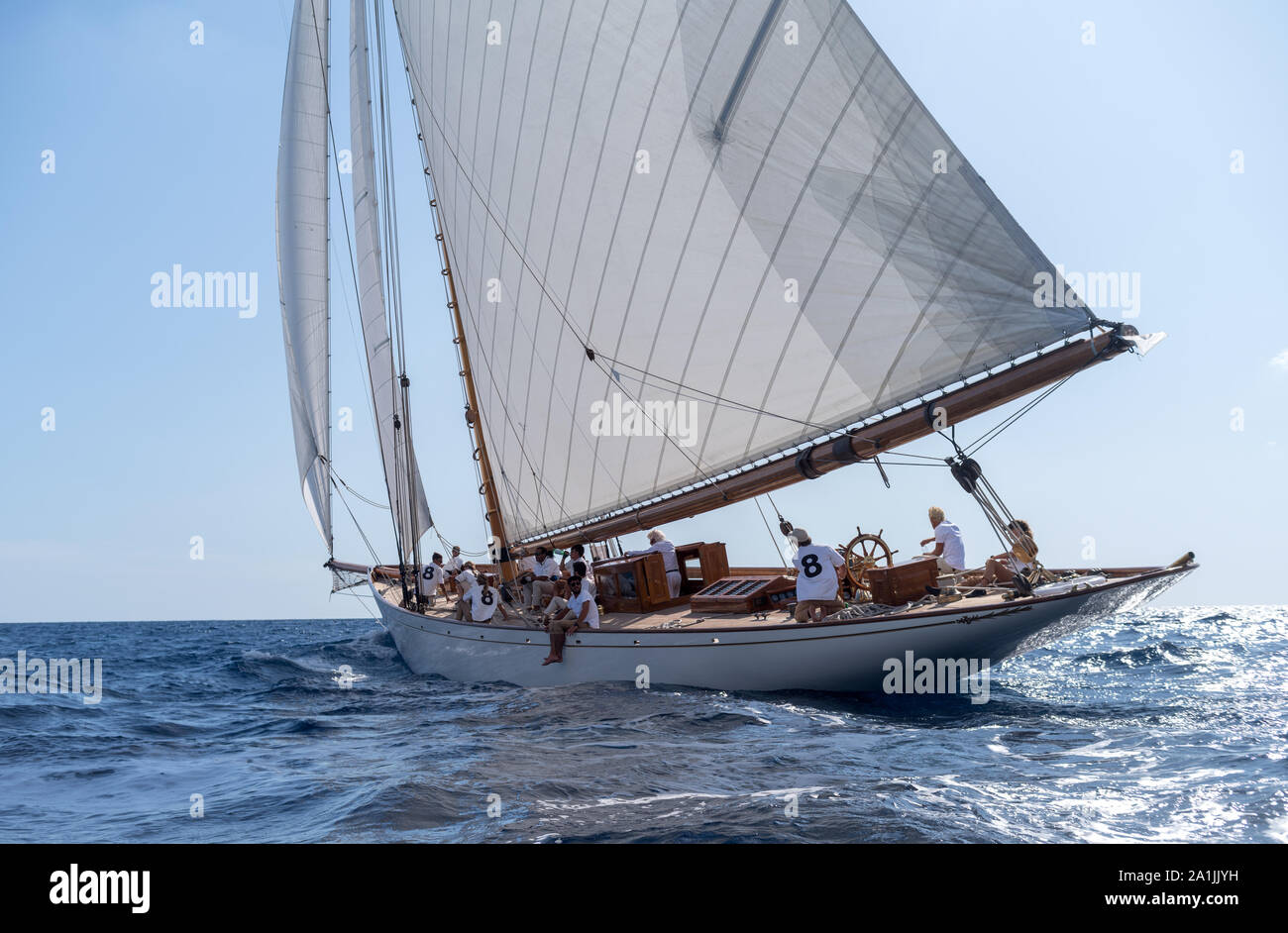 Crew members aboard on Moonbeam IV classic sail yacht, during regata in