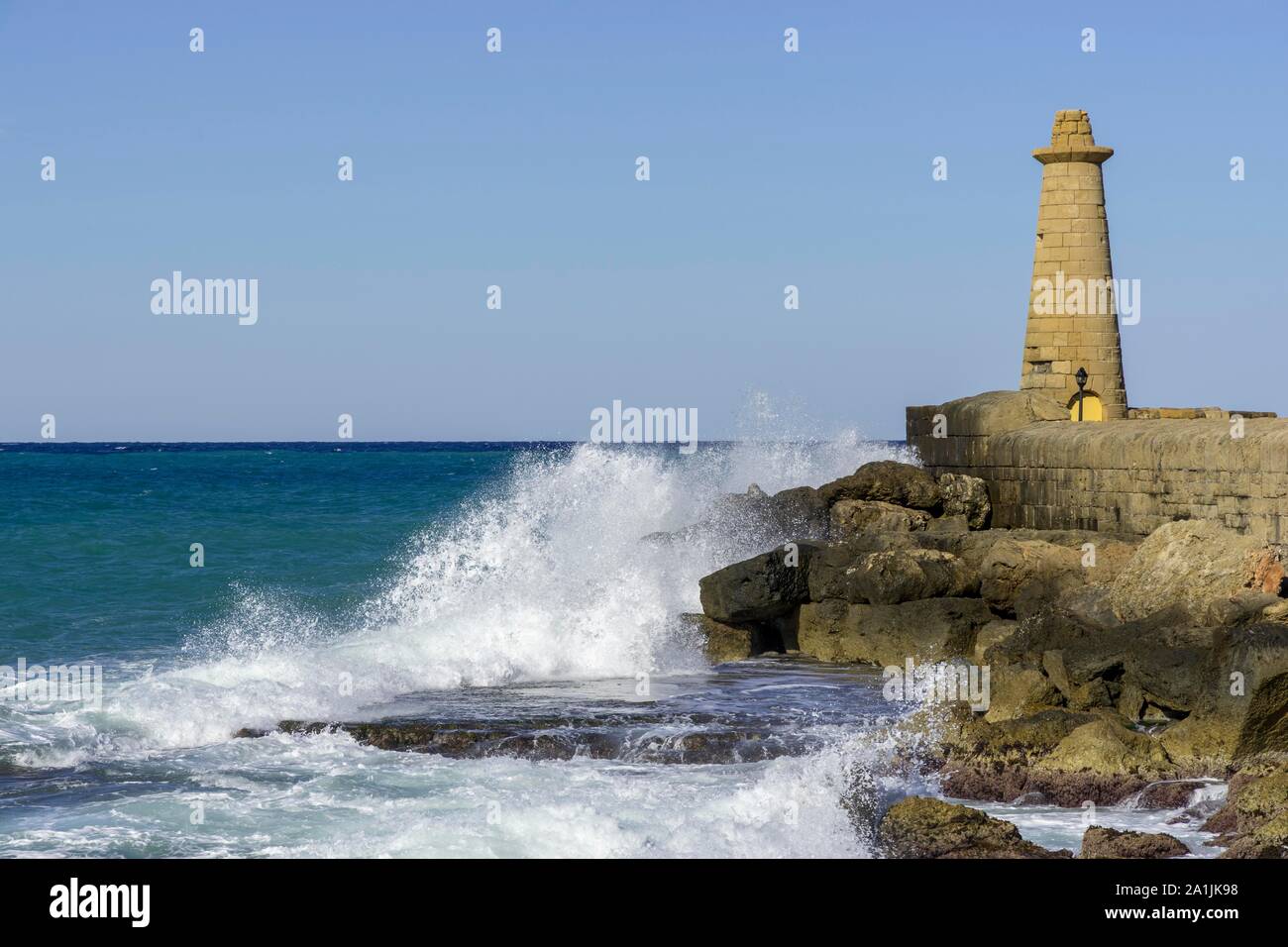 Surf with lighthousehouse, Port of Girne, District of Kyrenia, Turkish Republic of Northern Cyprus, Cyprus Stock Photo