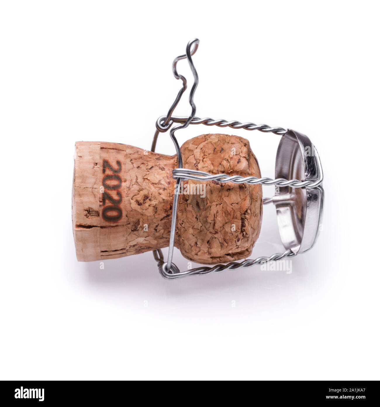 A champagne or sparkling wine cork from 2020 lying on the ground