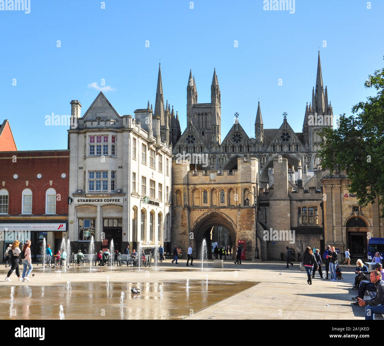 Cathedral Square with Norman Gate leading to the Cathedral beyond, Peterborough, Cambridgeshire, England, UK Stock Photo