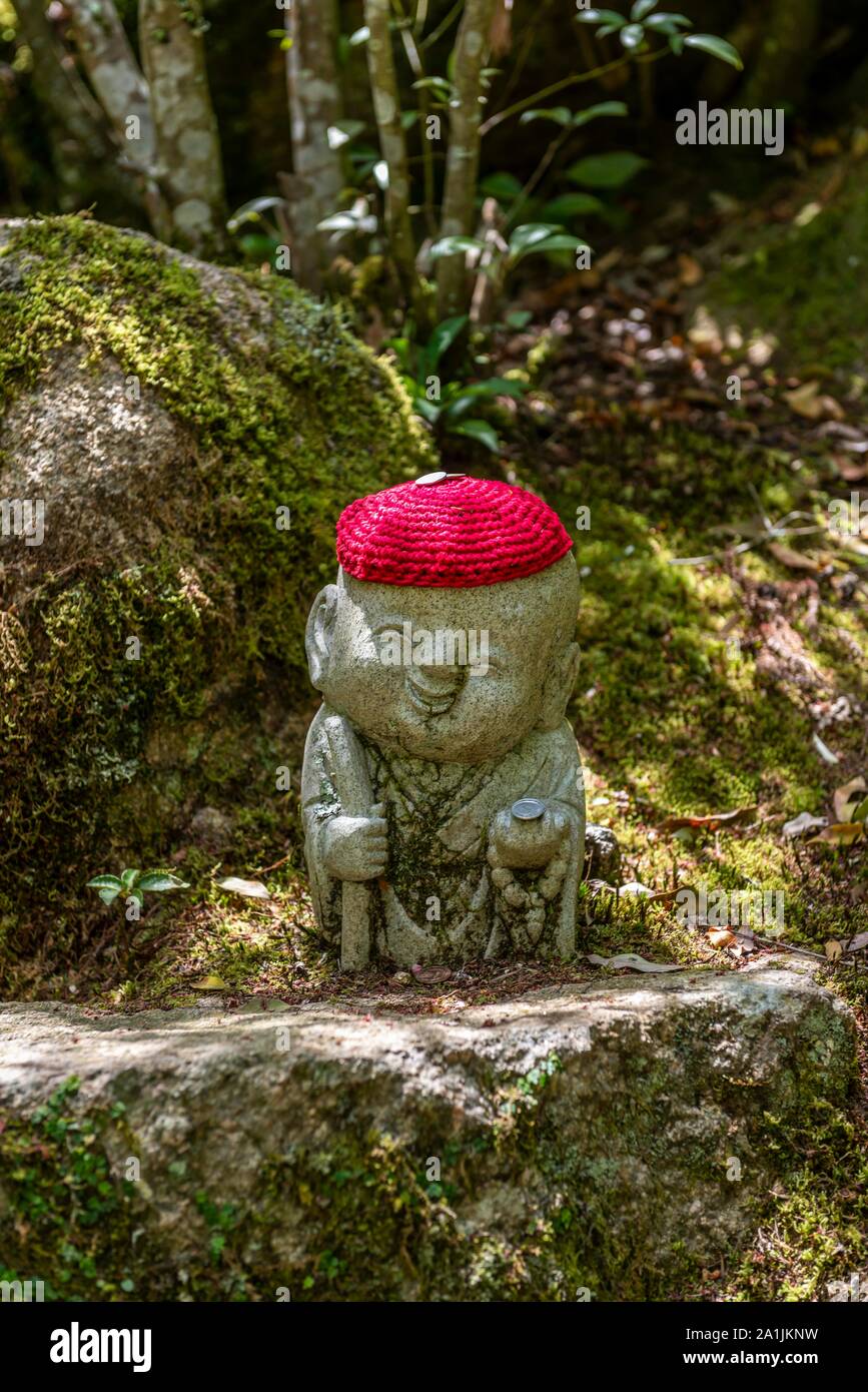 Buddha statue with colorful caps, Daisho-in temple complex, on Itsukushima Island, Miyajima, Hiroshima Bay, Japan Stock Photo