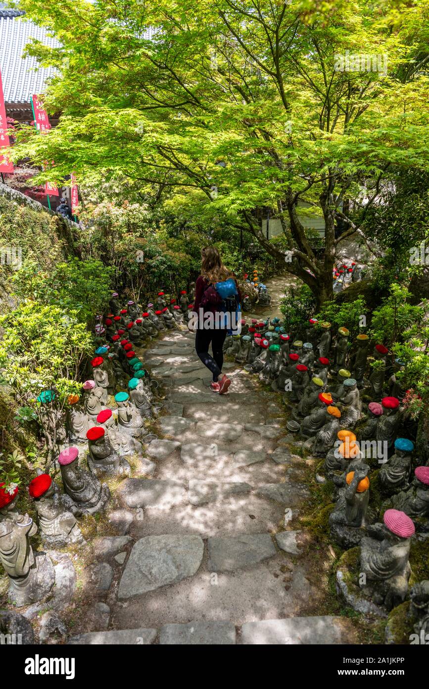 Buddha statue with colorful caps, Daisho-in temple complex, on Itsukushima Island, Miyajima, Hiroshima Bay, Japan Stock Photo