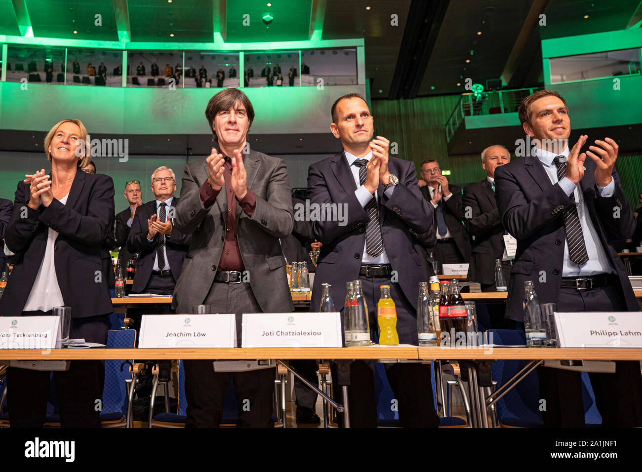 HANDOUT - 27 September 2019, Hessen, Frankfurt/Main: Applause and standing ovations for the honouring of Rauball by national coach of the women Martina Voss-Tecklenburg (l-r), national coach of the men Joachim Löw, sports director of national teams Panagiotis 'Joti' Chatzialexiou and Philipp Lahm at the 43rd ordinary DFB Bundestag in the Congress Center. The Bundestag of the German Football Association (DFB) is under the motto 'Bund für die Zukunft - Im Team den Fußball gestalten'. Photo: Thomas Boecker/DFB/dpa - ATTENTION: Only for editorial use and only with complete mention of the above cre Stock Photo