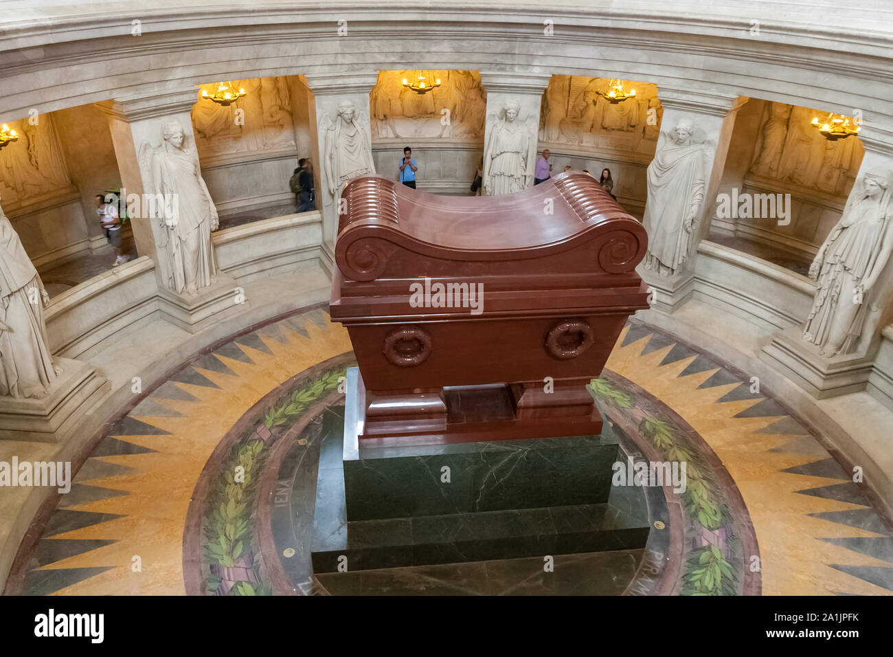 Aerial view of the red quartzite sarcophagus of Napoleon Bonaparte, resting on a green granite base directly under the Dôme des Invalides in Paris,... Stock Photo