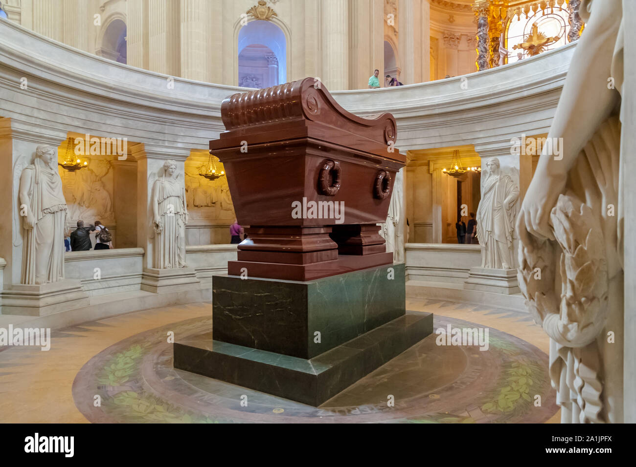 Close view of the red quartzite sarcophagus of Napoleon Bonaparte, resting on a green granite base directly under the Dôme des Invalides in Paris, one... Stock Photo