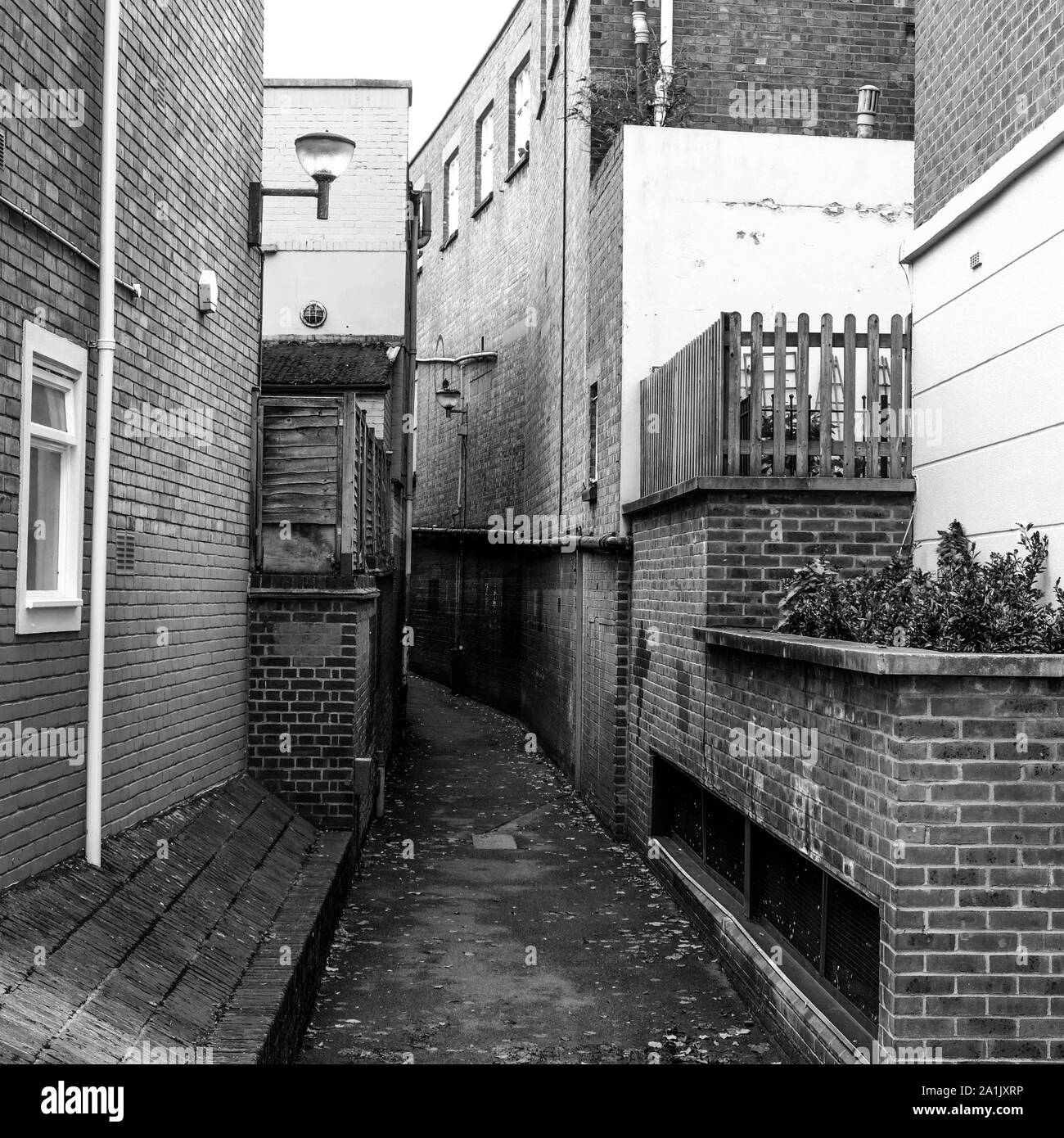 Narrow Alley Between Brick Buildings With No People In Kingston, England Stock Photo