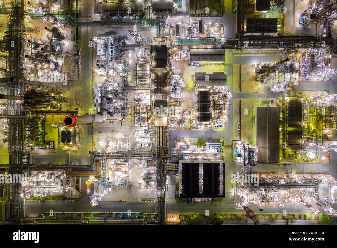 Aerial view of Oil and gas industry - refinery at twilight with chemical storage tank. Fuel and power generation, petrochemical factory industry, or e Stock Photo