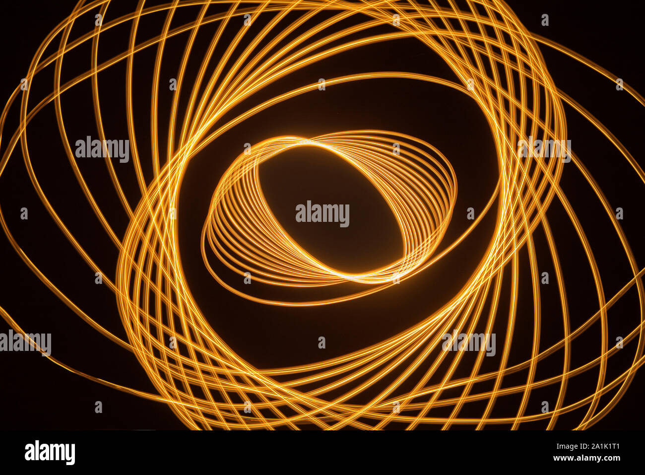 Light trails and patterns against black background Stock Photo