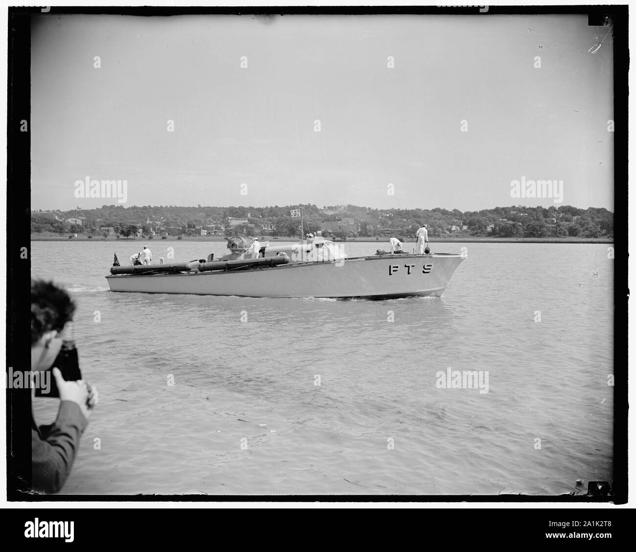 New 'Mosquito Boat' ready for action. Washington, D.C., June 19. The PT-9, first of the American Motor Torpedo Boats to be delivered to the U.S. Navy under the President's $15,000,000 experimental small craft program had a preview showing for the press today. The 'Mosquito Boat' and eight other ones will be based at the naval operating base, Norfolk, Va., where they will undergo service tests under various sea conditions to determine their capabilities and limitations. This is the same type of boat that the government is in the process of releasing to the British Navy. Chairman David L. Walsh Stock Photo