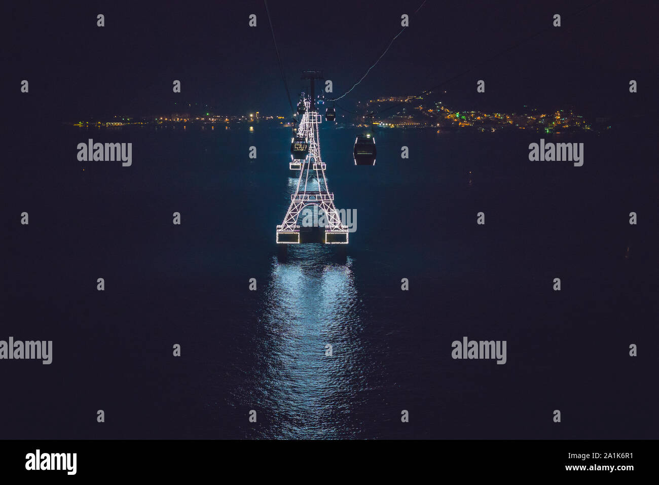 Night cable car over sea leading to Vinpearl land, Nha Trang, Vietnam Stock Photo