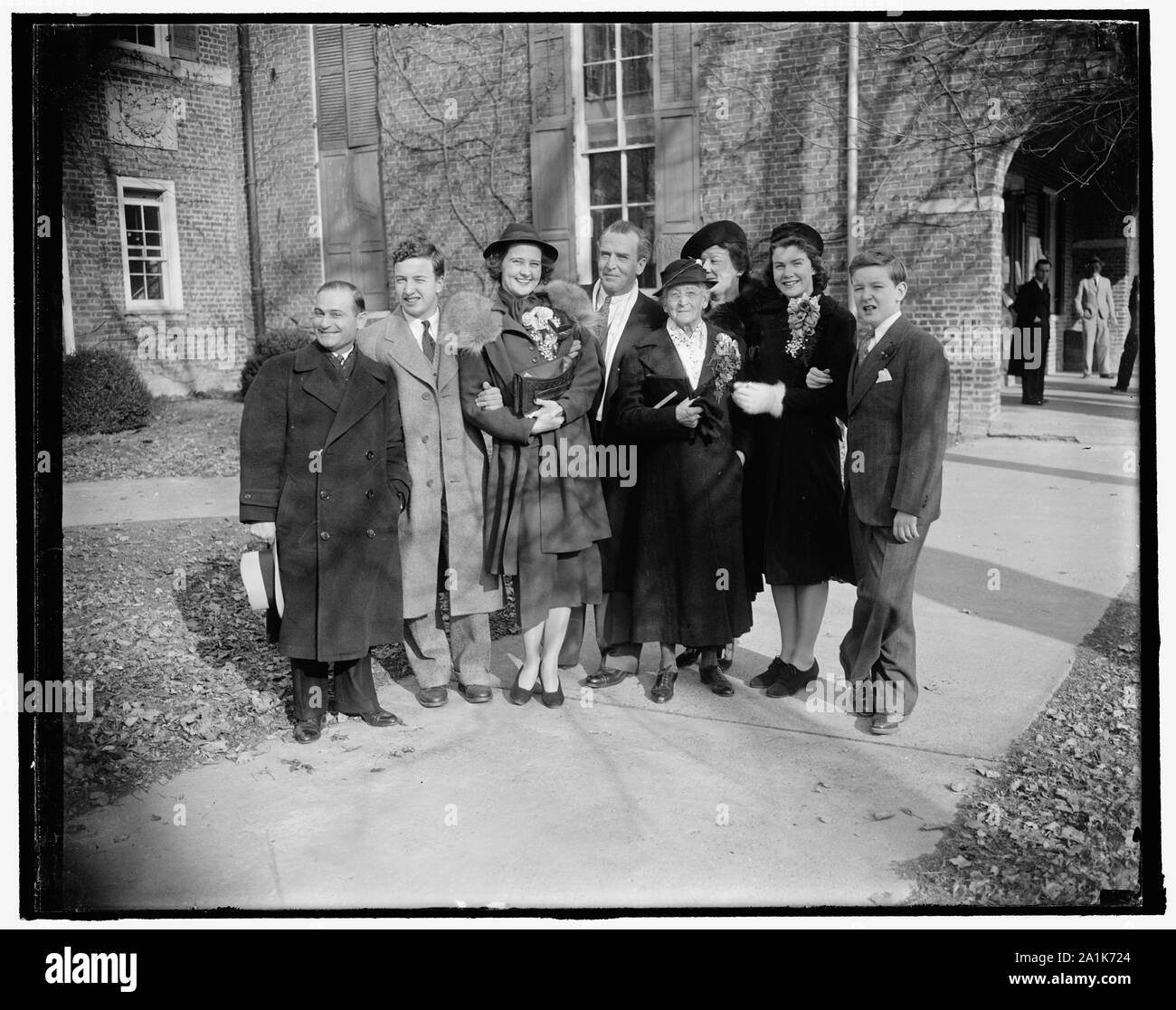 New Jersey senator weds in Virginia. Fairfax Courthouse, Va. Feb. 9. United States Senator William H. Smathers of New Jersey, with his bride the former Mary James Foley of Berryville, Va., are shown with a group of relatives and friends who witnessed the ceremony today in the historic courthouse here. In the photograph, left to right: Fred Yale of New Jersey; Joseph B. Smathers, son of the Senator by a previous marriage; Mrs. Smathers, the bride; Senator Smathers; Mrs. B.F. Smathers, the Senator's Mother; Mrs. William Abbott Coleman of Arlington, Va., Aunt of the Bride; Miss Billie Smathers, d Stock Photo
