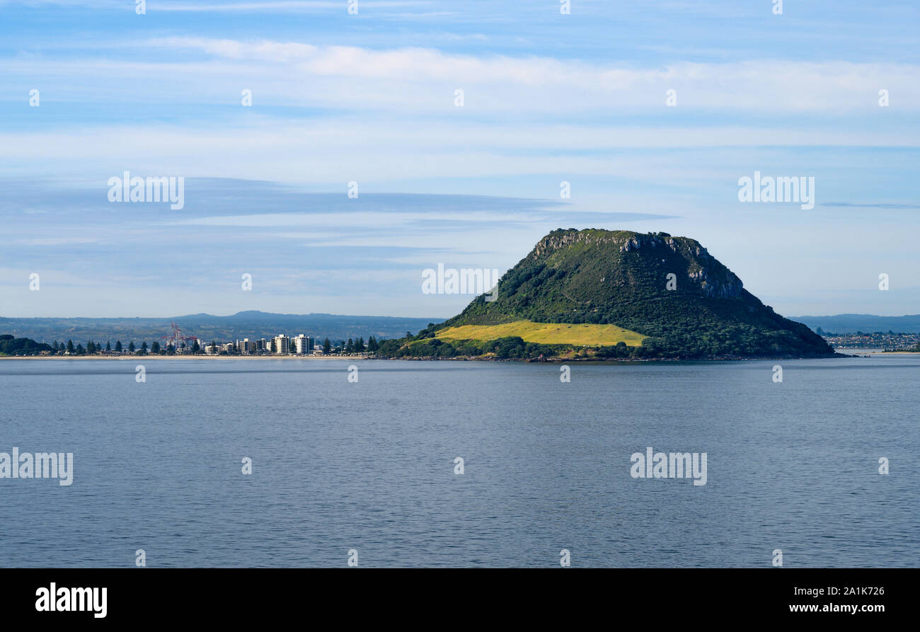 The lava dome, Mount Maunganui, sits at the entrance to Pilot Bay and the harbour of Tauranga, New Zealand. Stock Photo