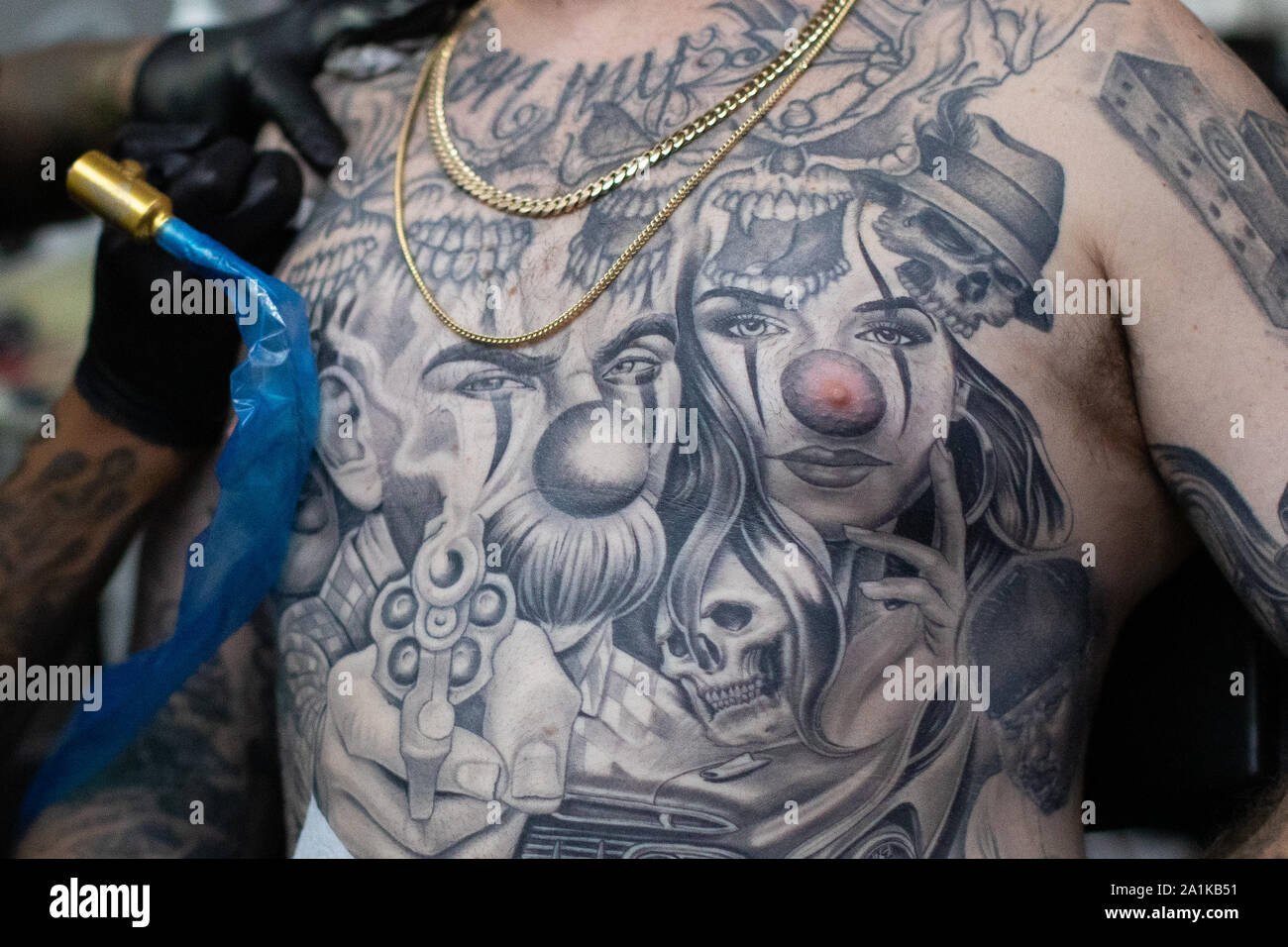 A man shows off his bodysuit during the International tattoo convention at  Tobacco Dock in east London Stock Photo - Alamy