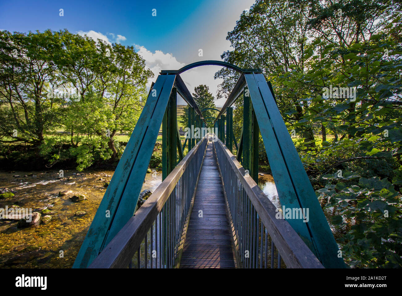 walkway bridge across the stream Stock Photo - Alamy