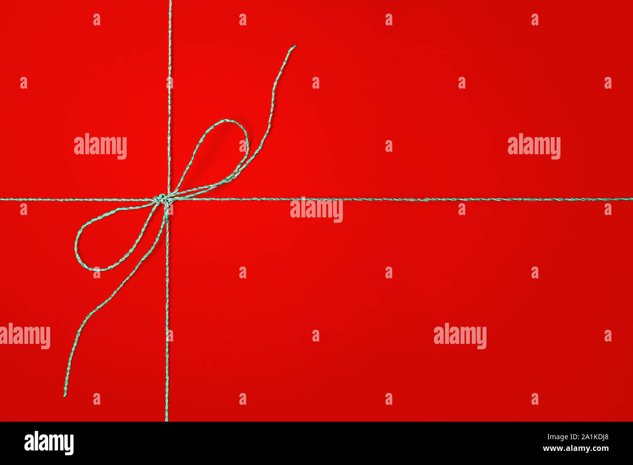 Red gift box with silver ribbon. Stock Photo