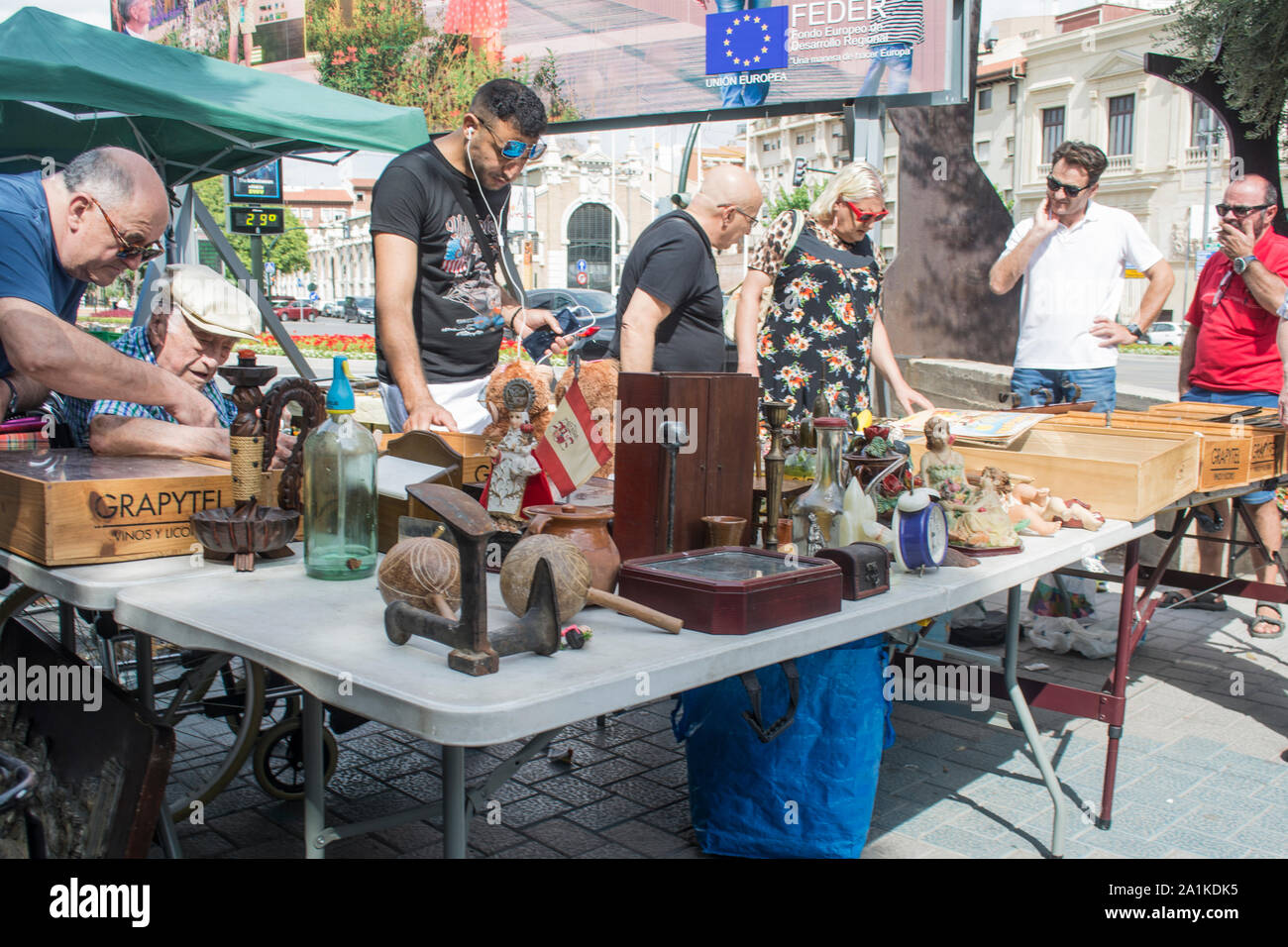 Shopper around the stalls on a street market during the Feria in the city of Murcia Spain Stock Photo