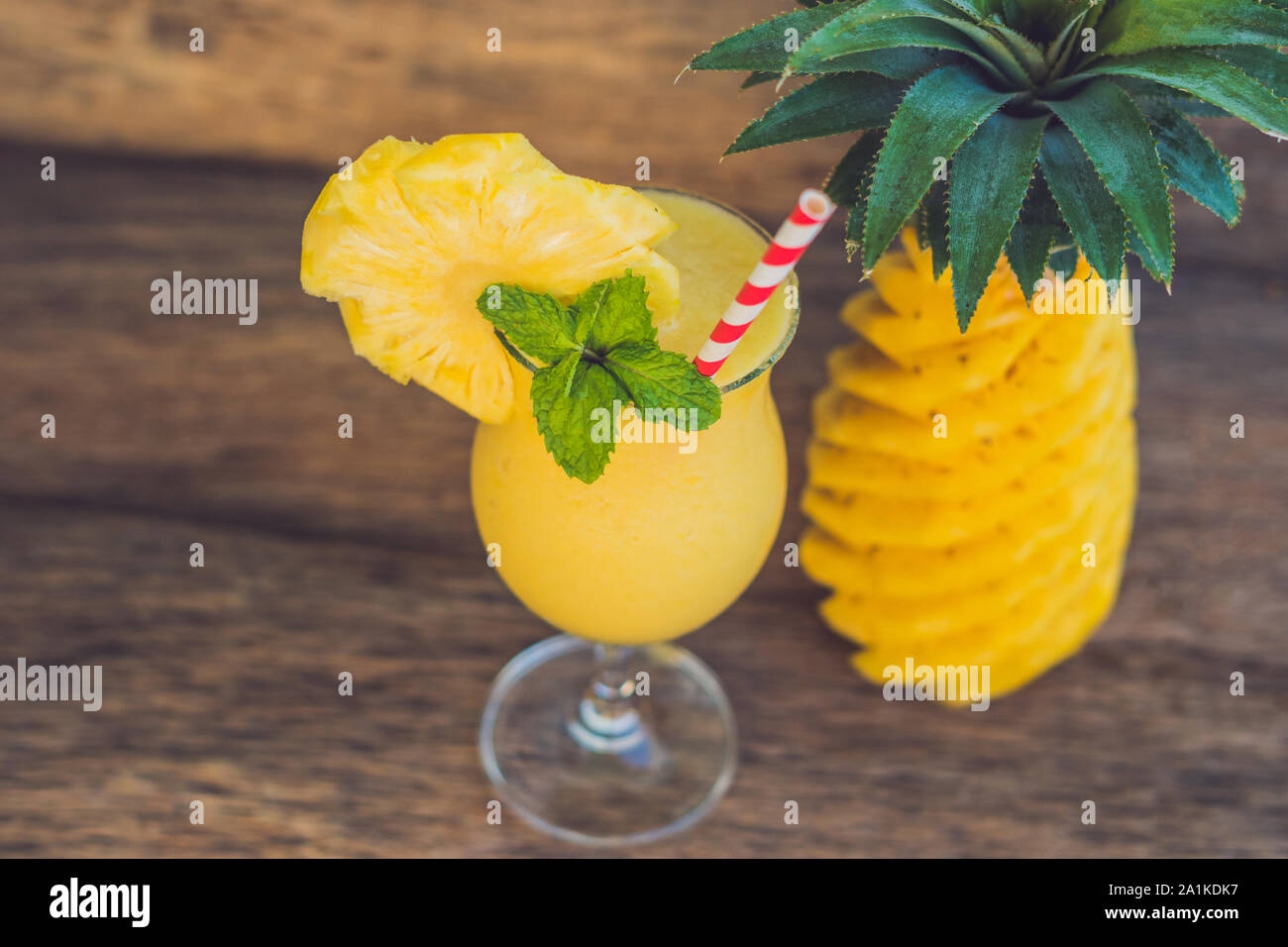 Pineapple and pineapple smoothies on an old wooden background Stock Photo
