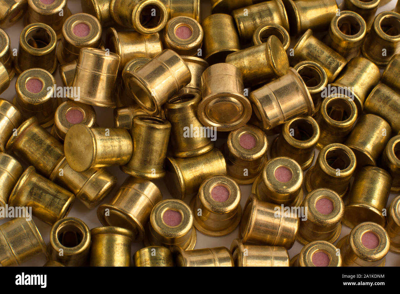 scattered copper hunting shotgun primers, close up Stock Photo