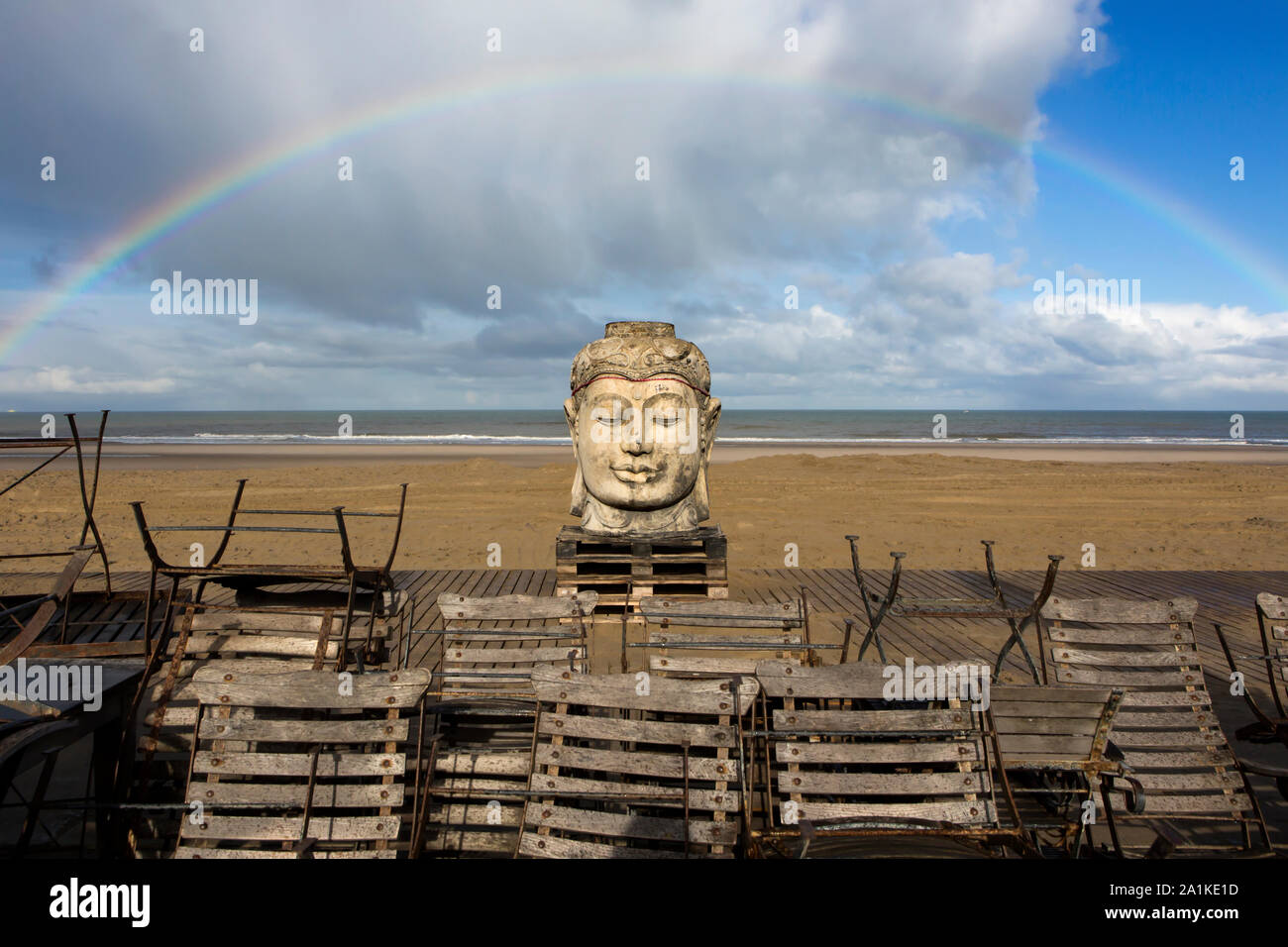 THE HAGUE - Budha statue with rainbow at the beginning of the beach season Stock Photo