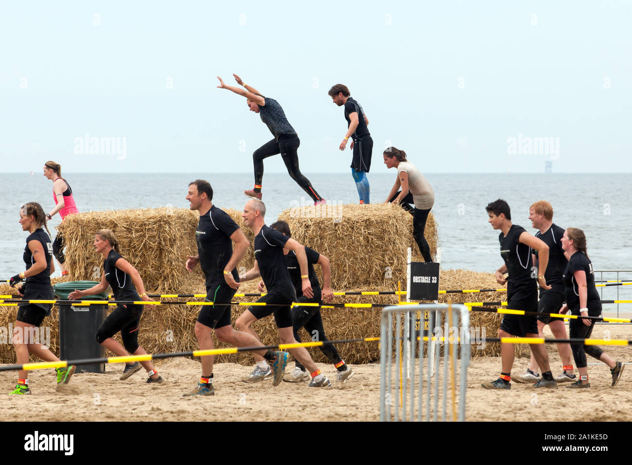 SCHEVENINGEN - More than 7000 people participated in the Mud Masters event  on the beach today Stock Photo - Alamy