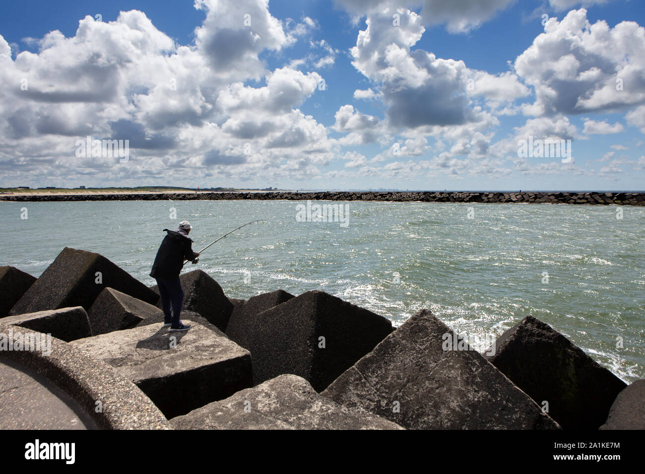 SCHEVENINGEN - The harbour pier is a popular fishing spot Stock Photo