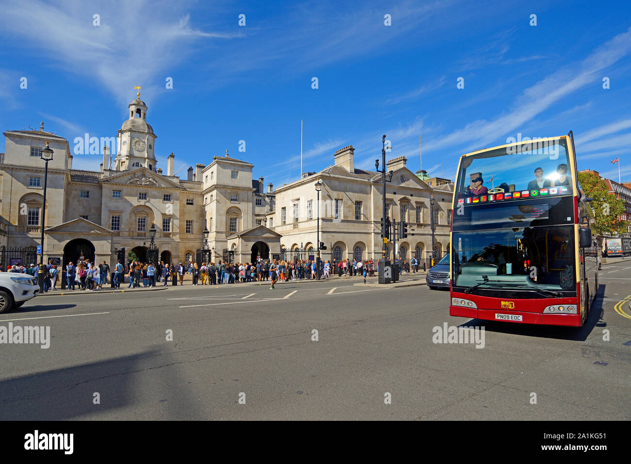 London, England, UK. Open-top tourist bus in Whitehall, by Horse Guards Parade Stock Photo