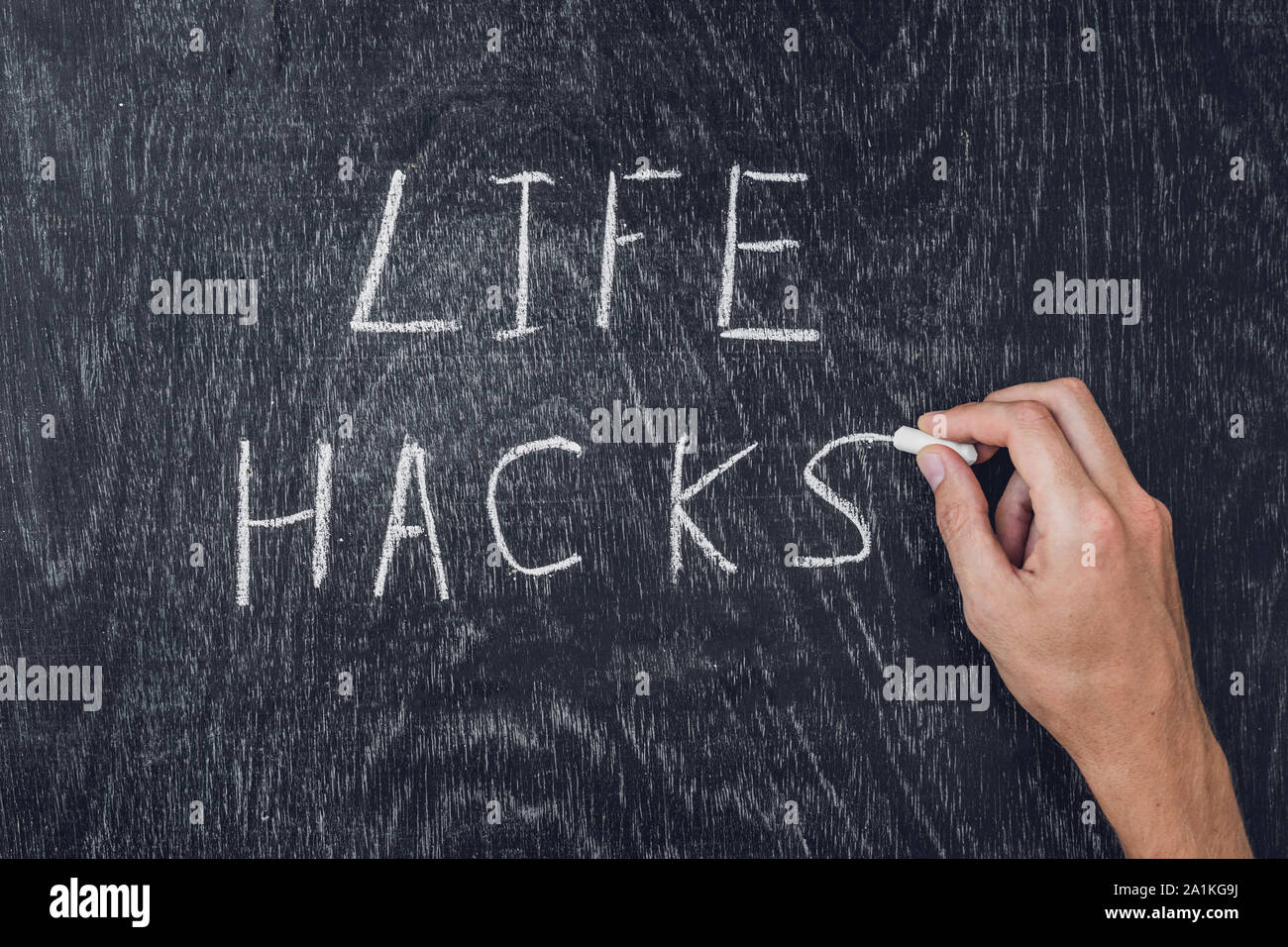 life hacks written on the blackboard using chalk Stock Photo