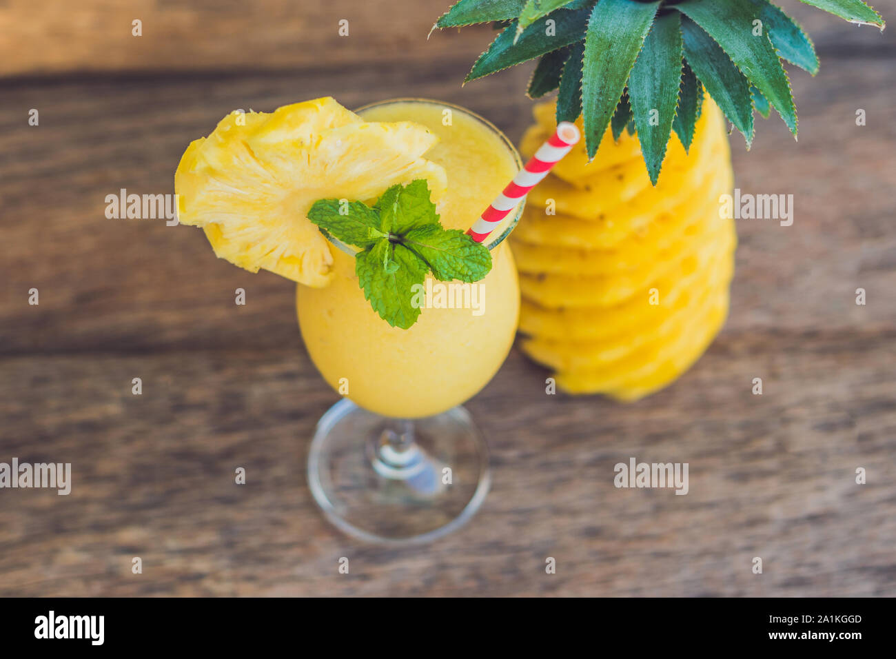 Pineapple and pineapple smoothies on an old wooden background Stock Photo