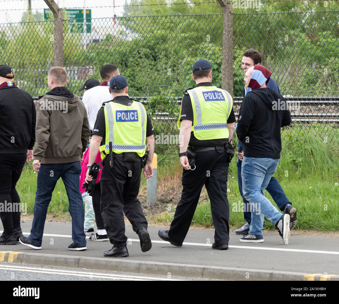 Police from Cleveland police force escort Aston Villa fans to Middlesbrough stadium for football match. Stock Photo