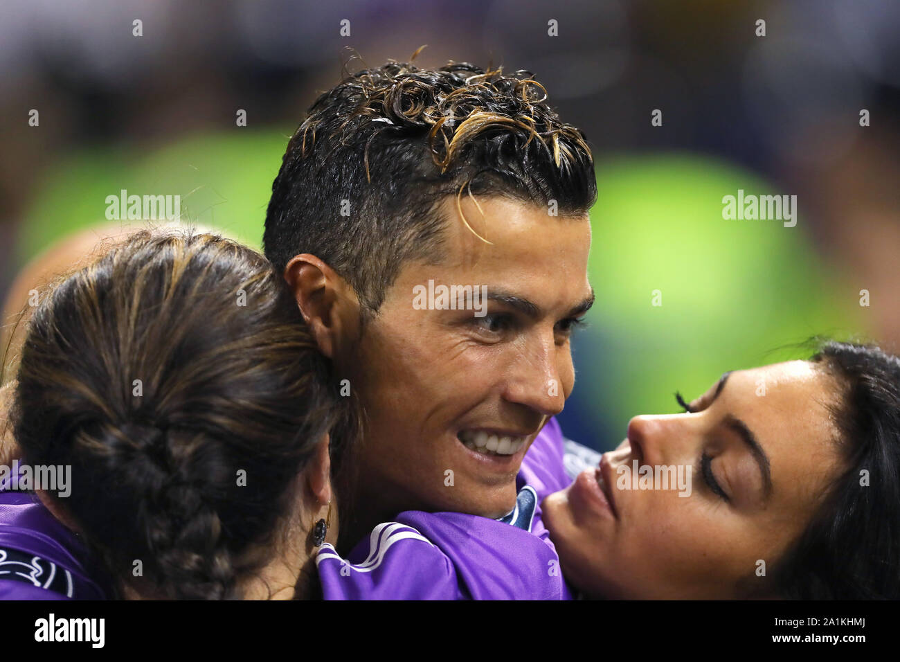 Cristiano Ronaldo of Real Madrid embraces with his mother, Maria Dolores dos Santos Aveiro and girlfriend, Georgina Rodriguez after winning the UEFA Champions League - Juventus v Real Madrid, UEFA Champions League Final, National Stadium of Wales, Cardiff - 3rd June 2017. Stock Photo