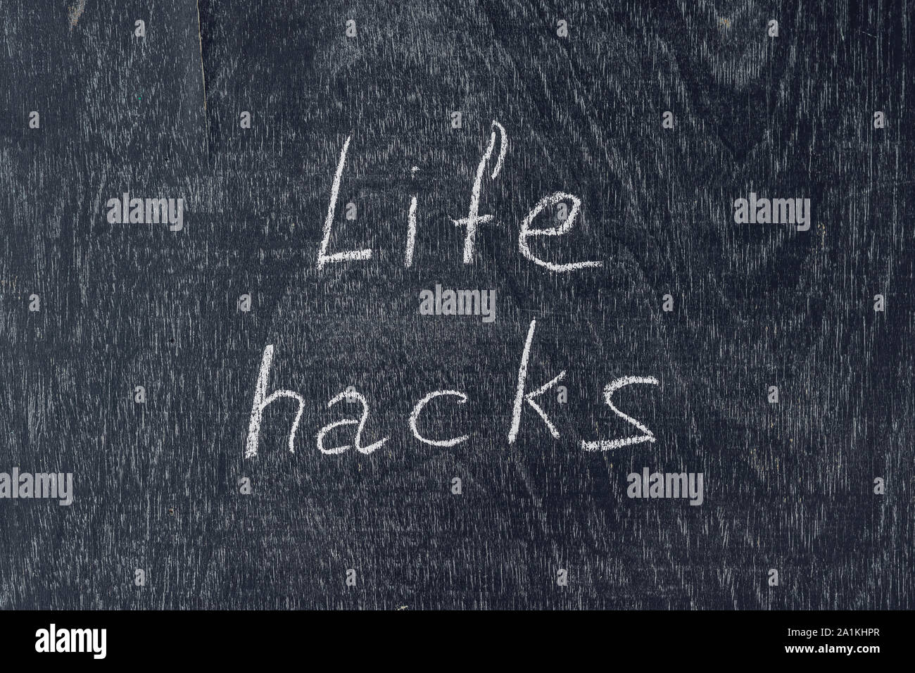 life hacks written on the blackboard using chalk Stock Photo