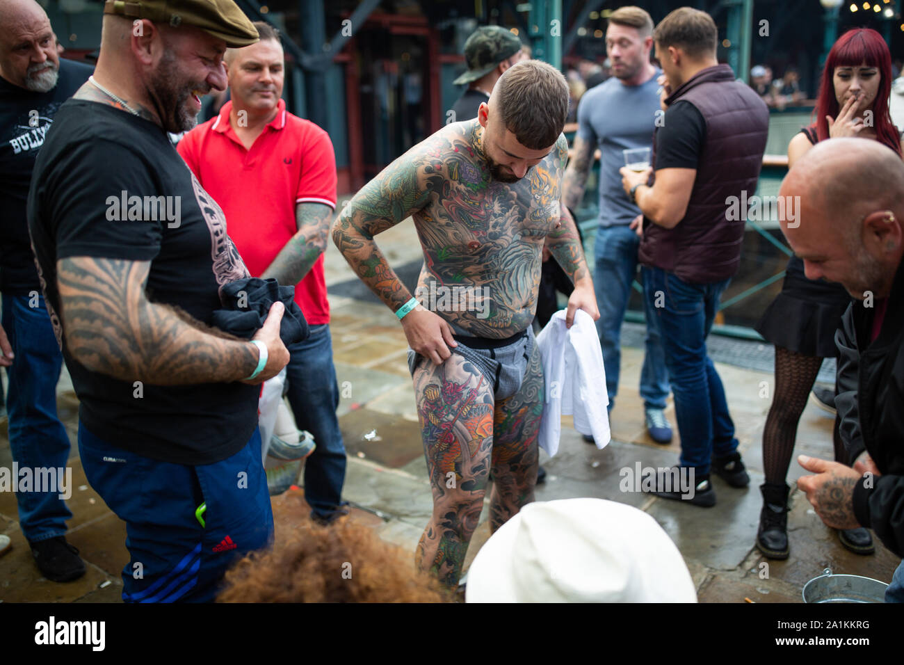tobacco dock tattoo convention A man shows of his tattoos during the International tattoo convention at Tobacco  Dock in east London Stock Photo