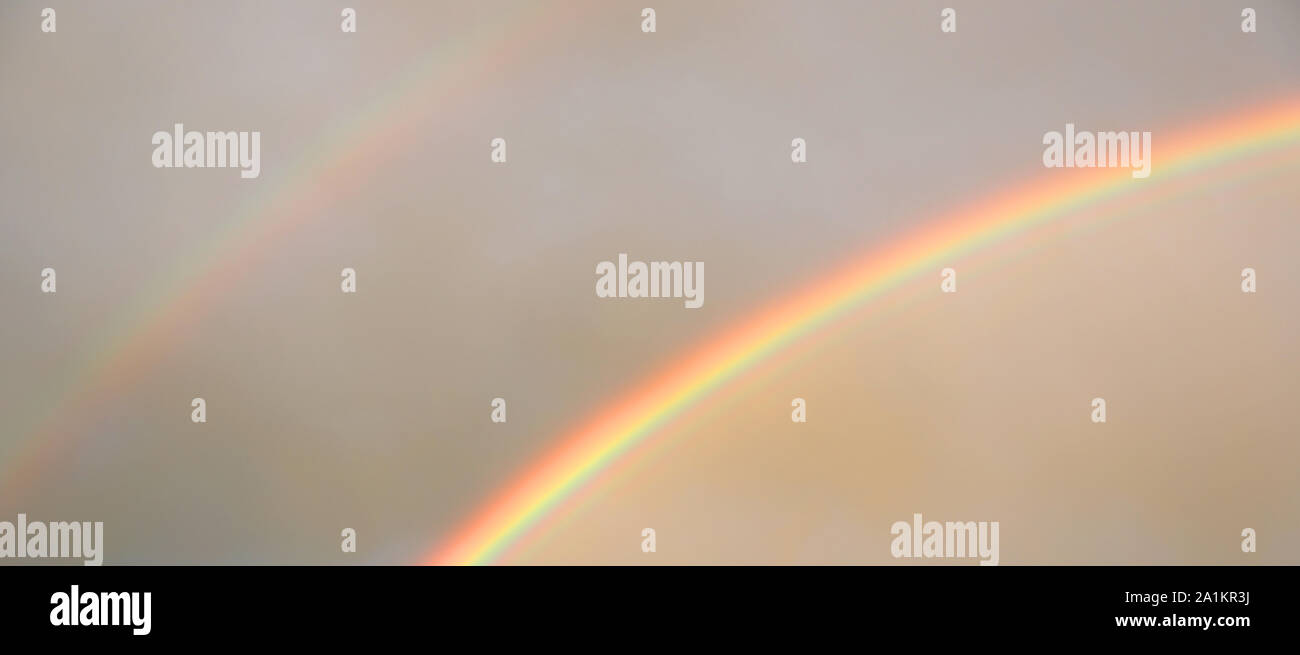 double rainbow after the storm with vivid colors Stock Photo - Alamy