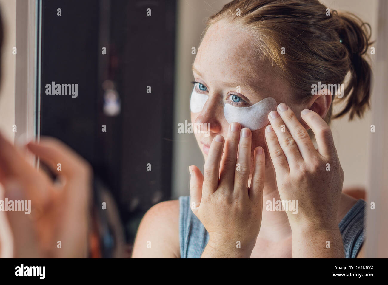 Portrait Of Beauty Red Haired Woman With Eye Patches Showing An