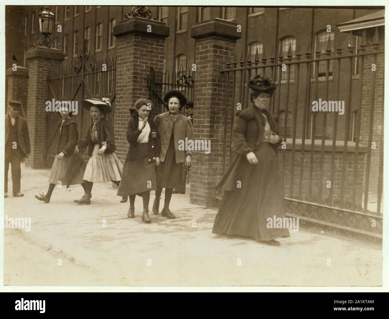 Noon hour, Cocheco Mfg. Co., Dover, N.H. May 17, 1909. Young girls working regularly. A number of others there, some even younger. Stock Photo