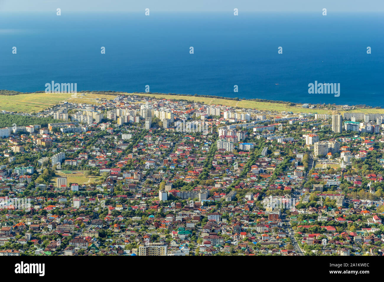 Scenic aerial view of Gelendzhik resort city district and Black sea coastline. Sunny day. Stock Photo