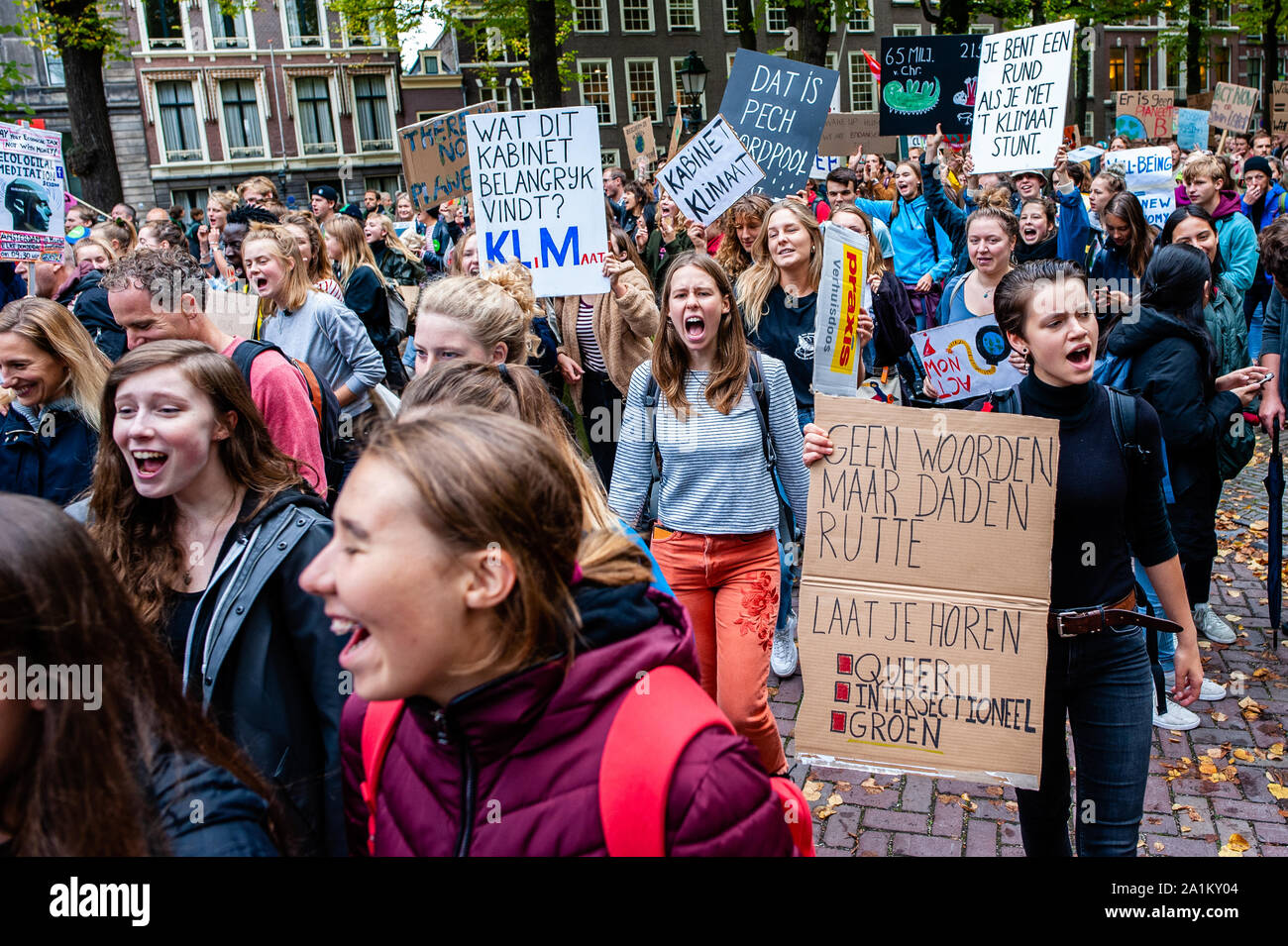 Dutch students shouting slogans while walking during the demonstration.Large coalition of organizations in The Netherlands organized the climate strike, and it is part of the largest international climate mobilisation in history. Building on the successful youth strikes that started almost a year ago, thousands of people strike together for the first time to demand a liveable and just world, now and for the future. Stock Photo