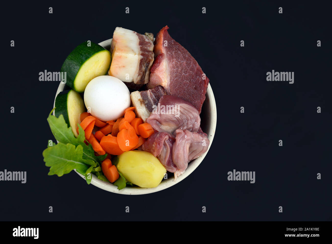 Dog or cat bowl filled with mixture of biologically appropriate raw