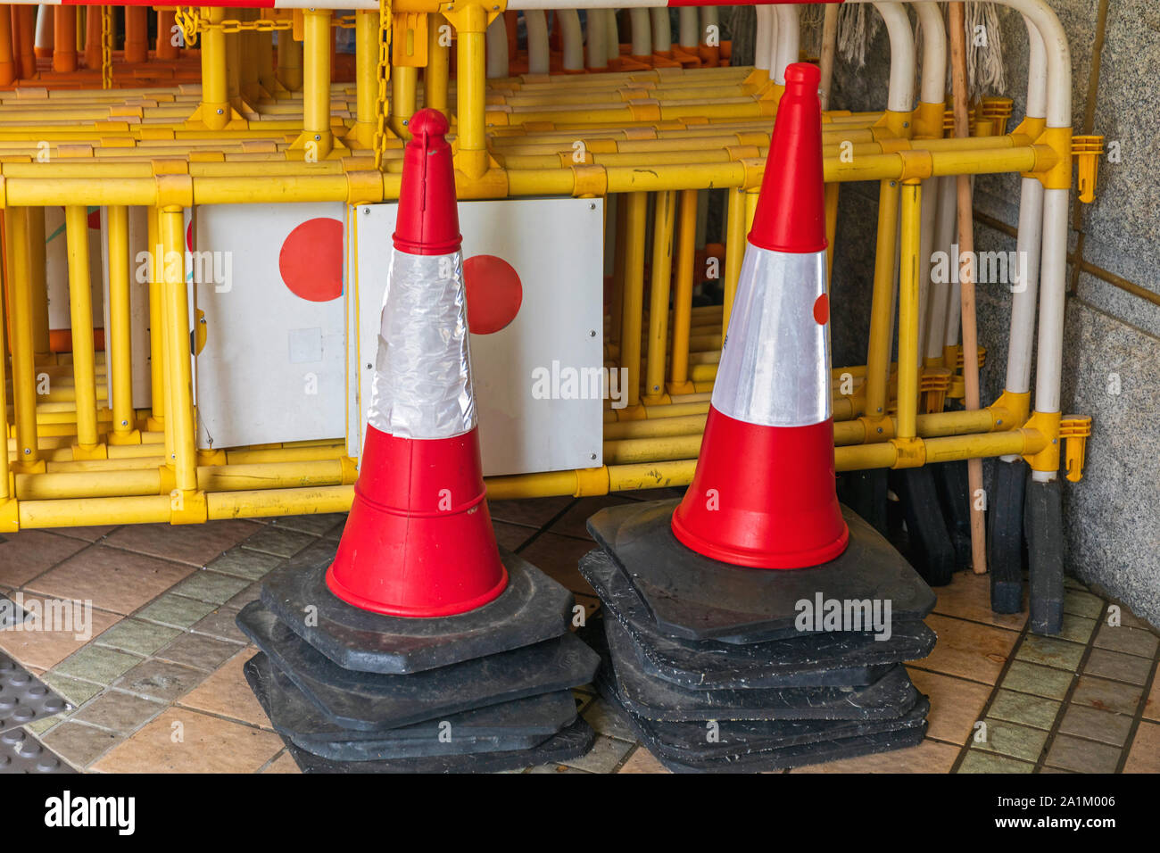 Stacked Traffic Cones and Construction Barriers Barricades Stock Photo