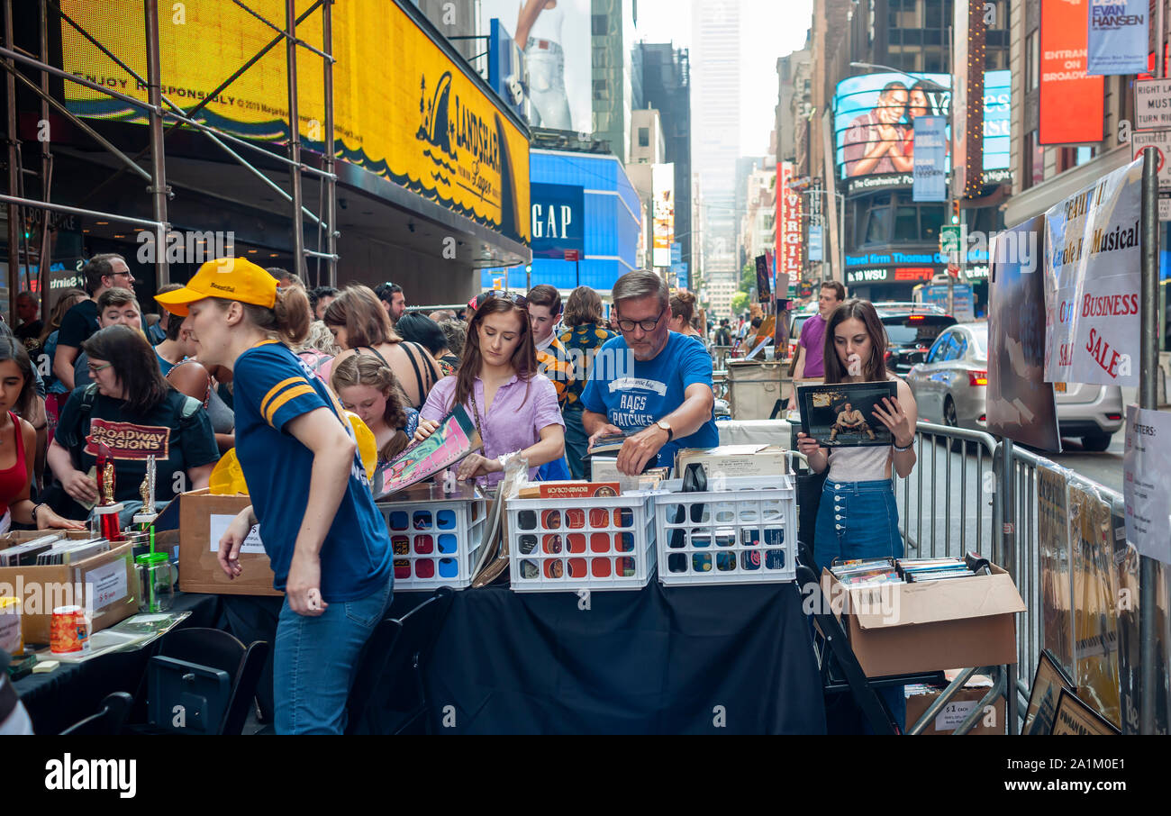 Thousands of fans of Broadway crowd the 33rd Annual Broadway Flea Market & Grand Auction in New York to pour over and purchase memorabilia from vintage Playbills to one-of-a-kind props in New York on Sunday, September 22, 2019. Over 50 tables from Broadway shows and theater related institutions and businesses occupy the streets around Shubert Alley offering their Broadway related wares and autographs. The fair is a fundraiser for the Broadway Cares/Equity Fights Aids charity.  (© Richard B. Levine) Stock Photo