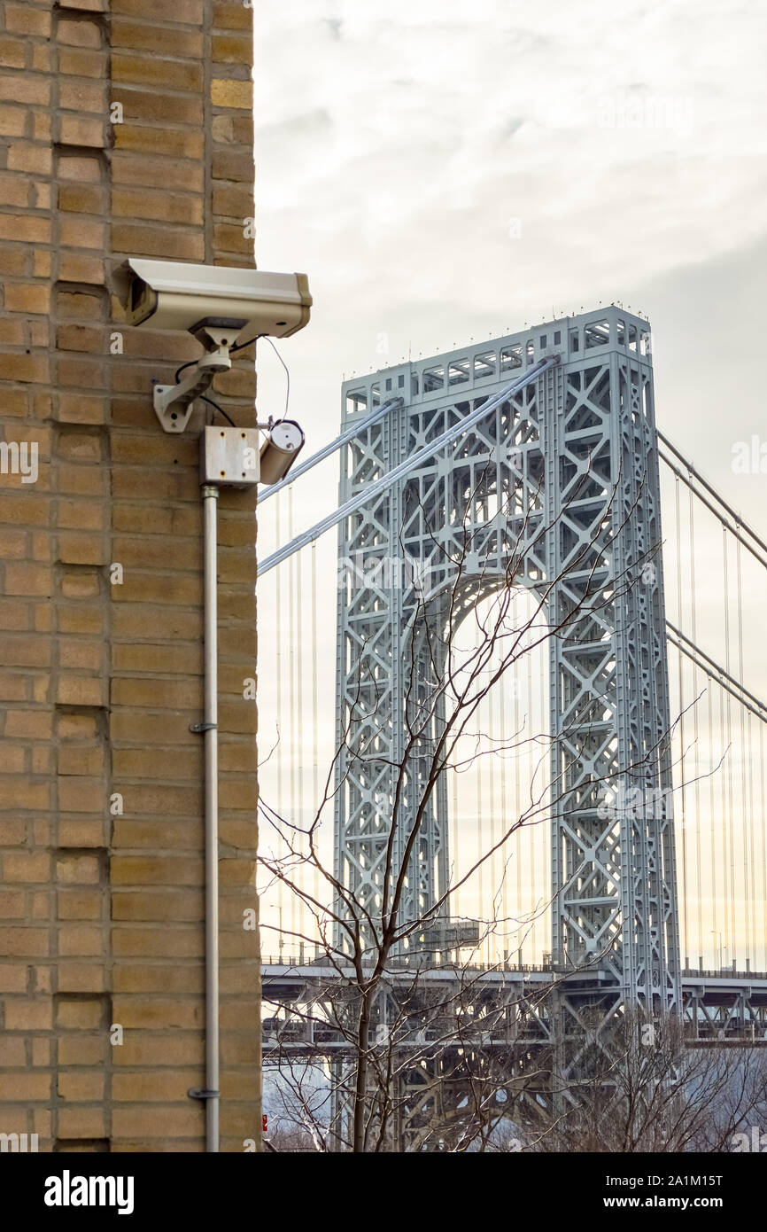Washington Heights, New York - February 14, 2012: A surveillance camera monitors a building in NYC near the George Washington Bride. Stock Photo
