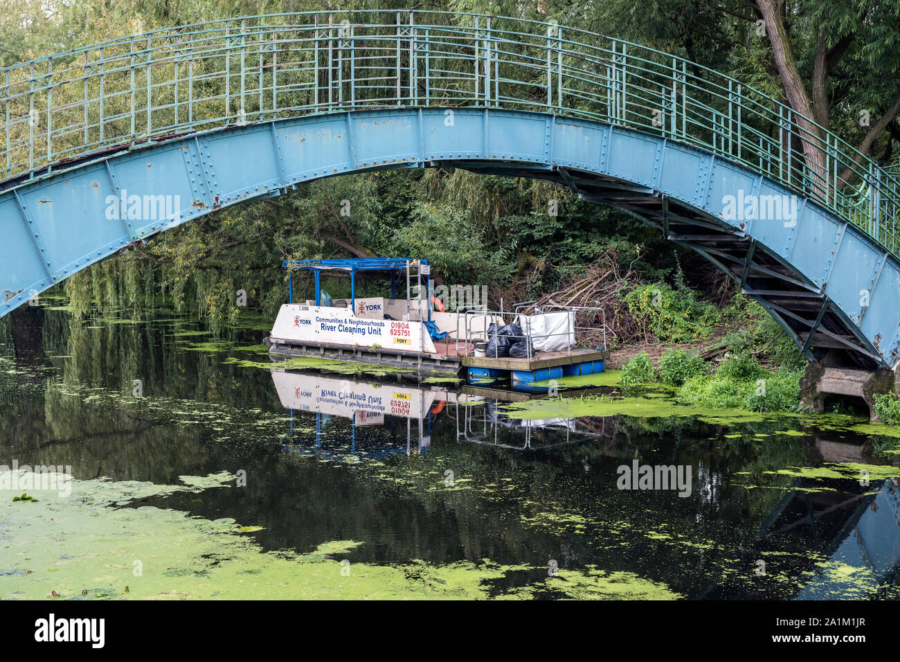 Blue and White Communities and Neighbourhoods River Cleaning Unit barge
