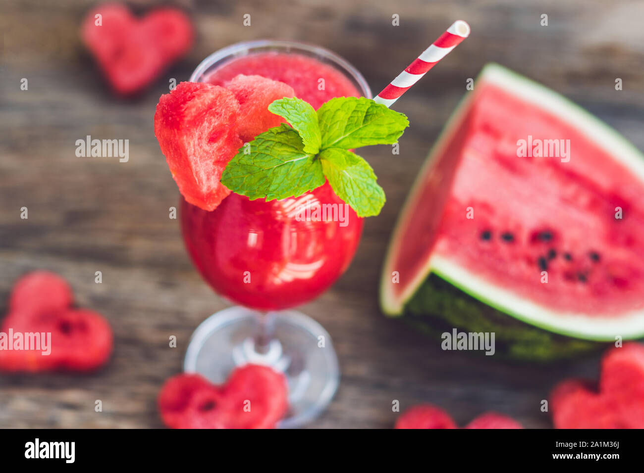 Healthy watermelon smoothie with mint, a piece of watermelon, hearts