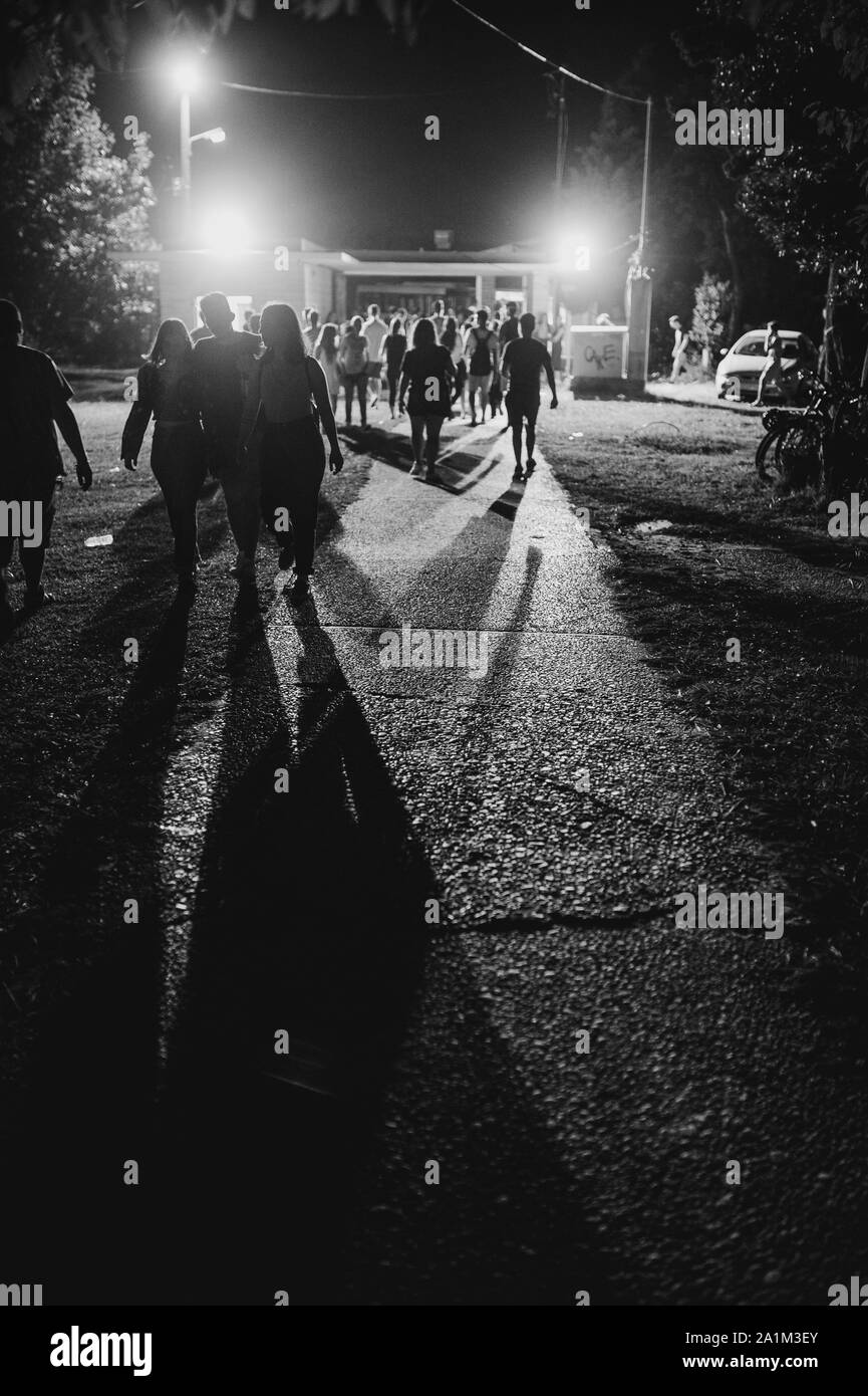 people going to the party, night photograph of a crowd Stock Photo