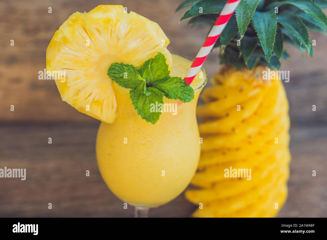 Pineapple and pineapple smoothies on an old wooden background Stock Photo
