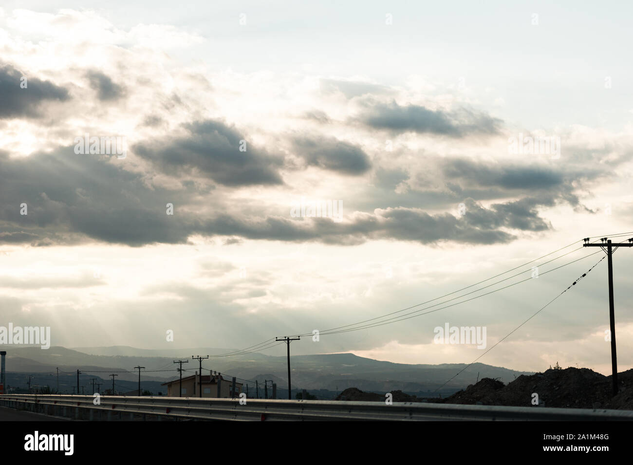 landscape frame, cloudy landscape, blue yellow green and orange sky with mountains Stock Photo