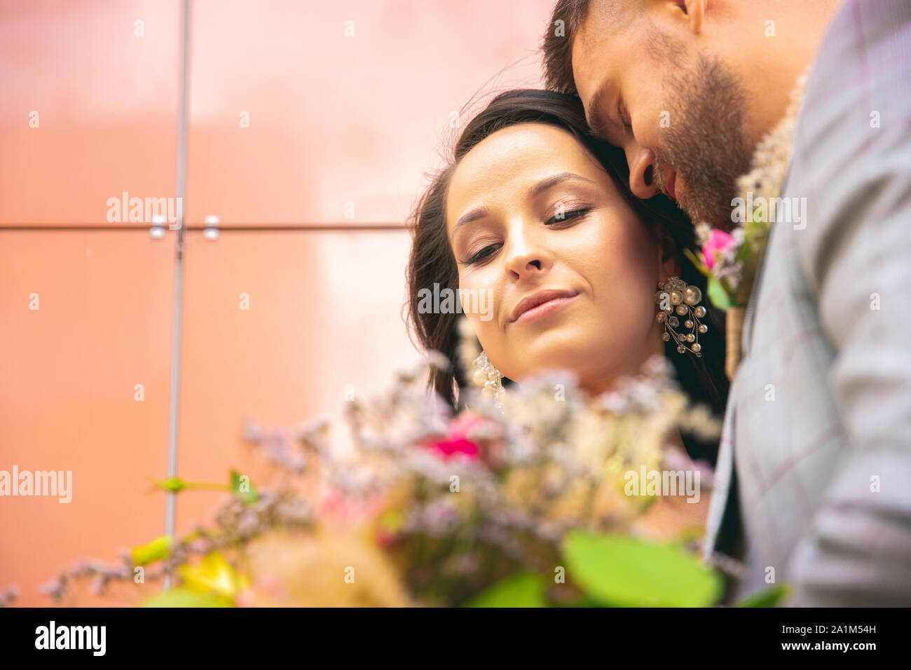 Caucasian romantic young couple celebrating their marriage in city