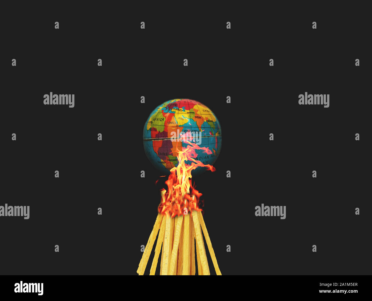 Concept of Climate change or Global warming showing with burning the globe or earth on black background Stock Photo