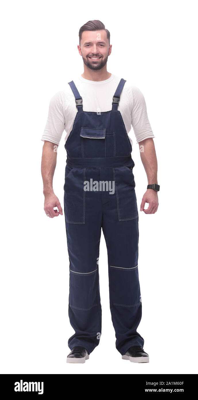 confident young man in blue overalls . isolated on white Stock Photo
